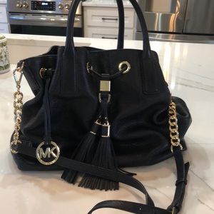 Black leather bag with tassels